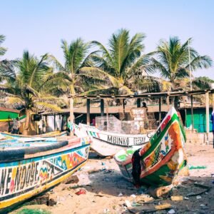 TANJI, THE GAMBIA - NOVEMBER 21, 2019: Traditional fishing boats in Tanji. Fishing village. Gambia, West Africa.